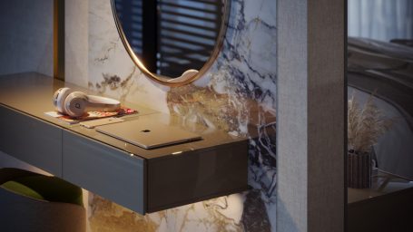 Lavabo moderno con espejo circular y superficie de mármol, detalles en luz suave.