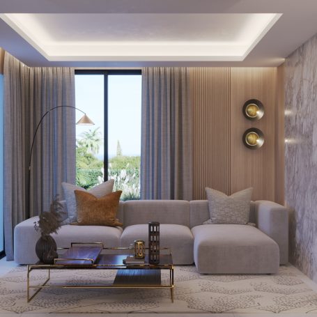 Sala moderna con sofá gris, mesa de café y cortinas claras, iluminada con luz natural.