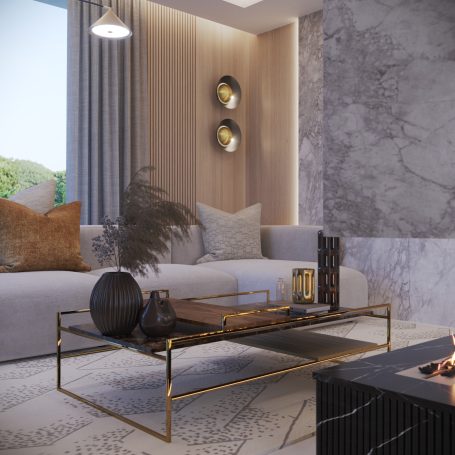 Sala moderna con sofá gris, mesa de café dorada y decoración elegante en tonos neutros.